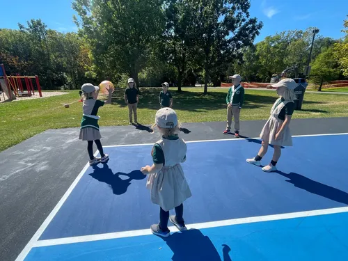 Children enjoying outdoor ball activities at Alderwood Academy