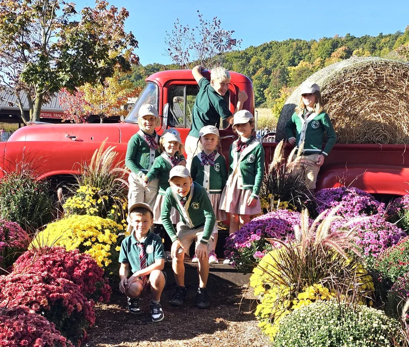 Educational workshops - students and families with vintage truck and autumn activities at Alderwood Academy