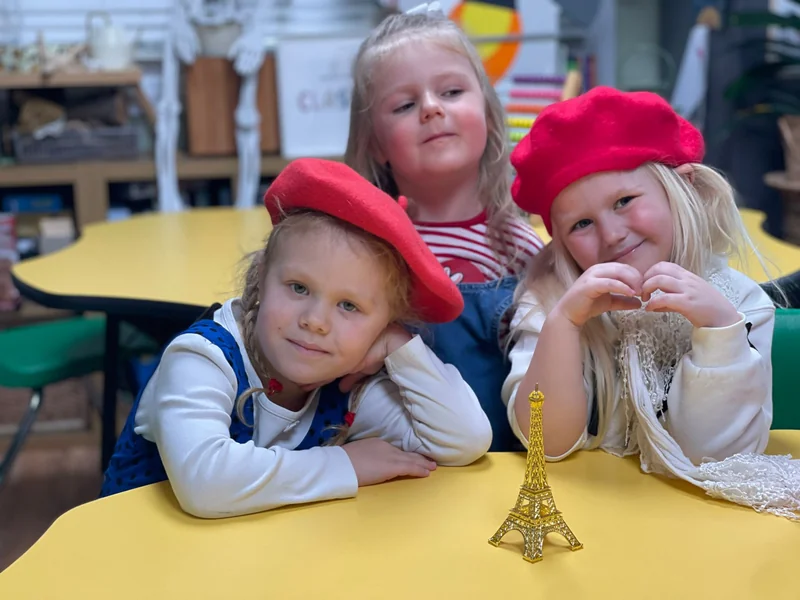 French Language Education - students with Eiffel Tower and berets