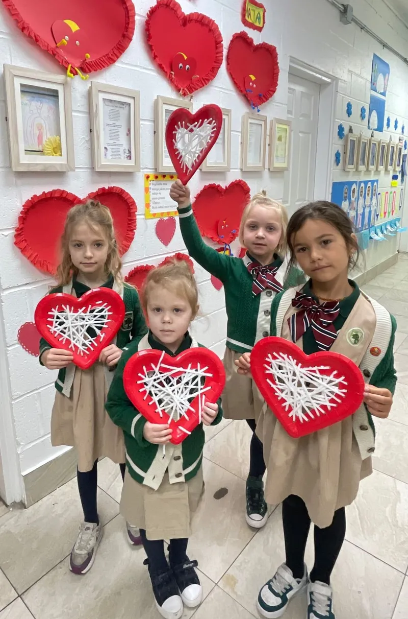 Students creating Valentine heart crafts celebrating culture and heritage at Alderwood Academy